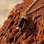 Milestone necklace black stone goldplated in the sunset