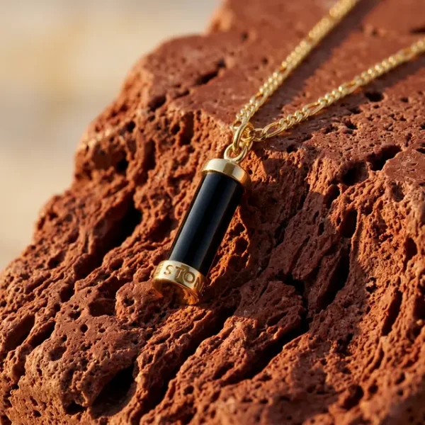 Milestone necklace black stone goldplated in the sunset